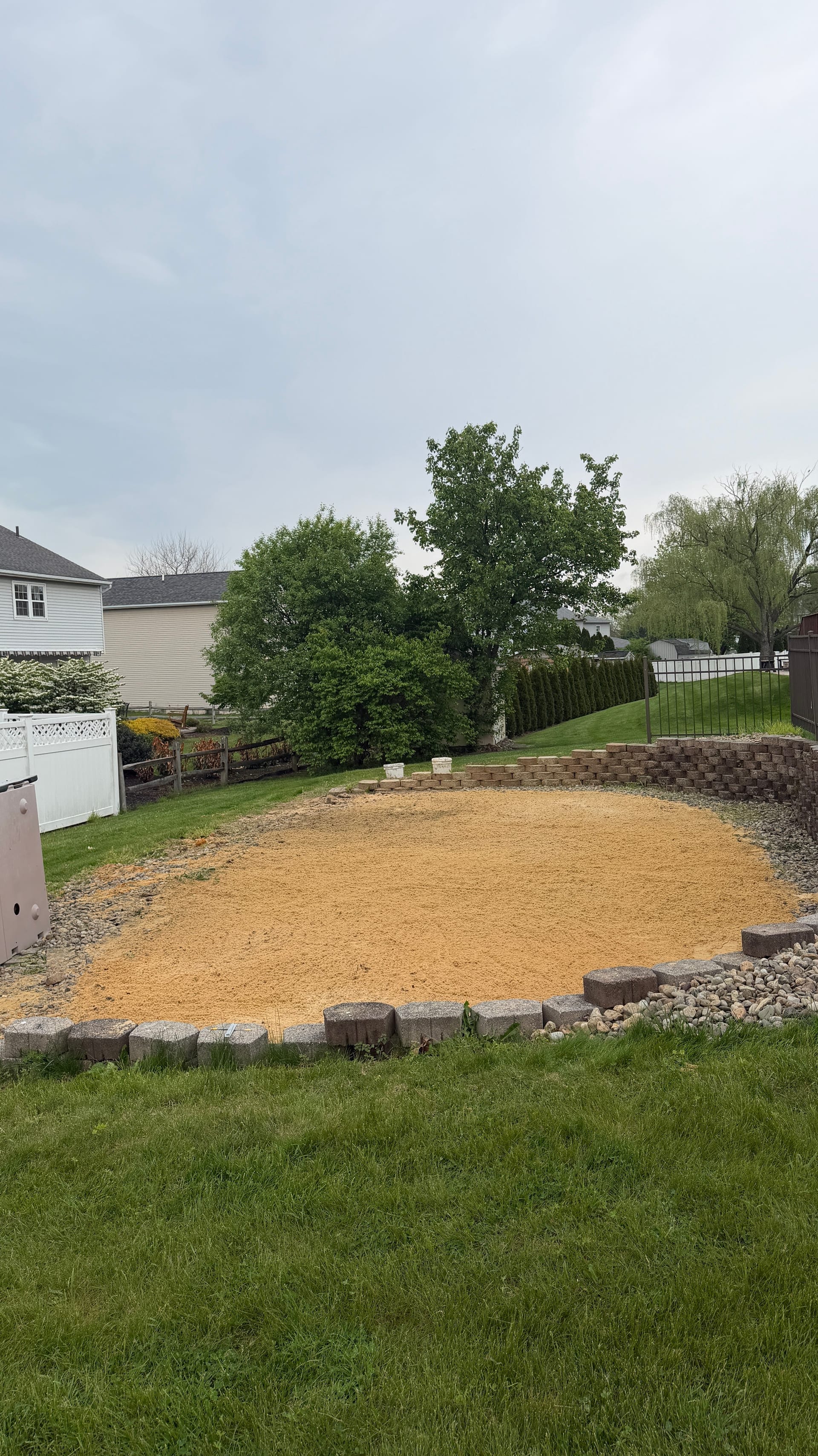 Clean gravel pad where the above-ground pool used to stand